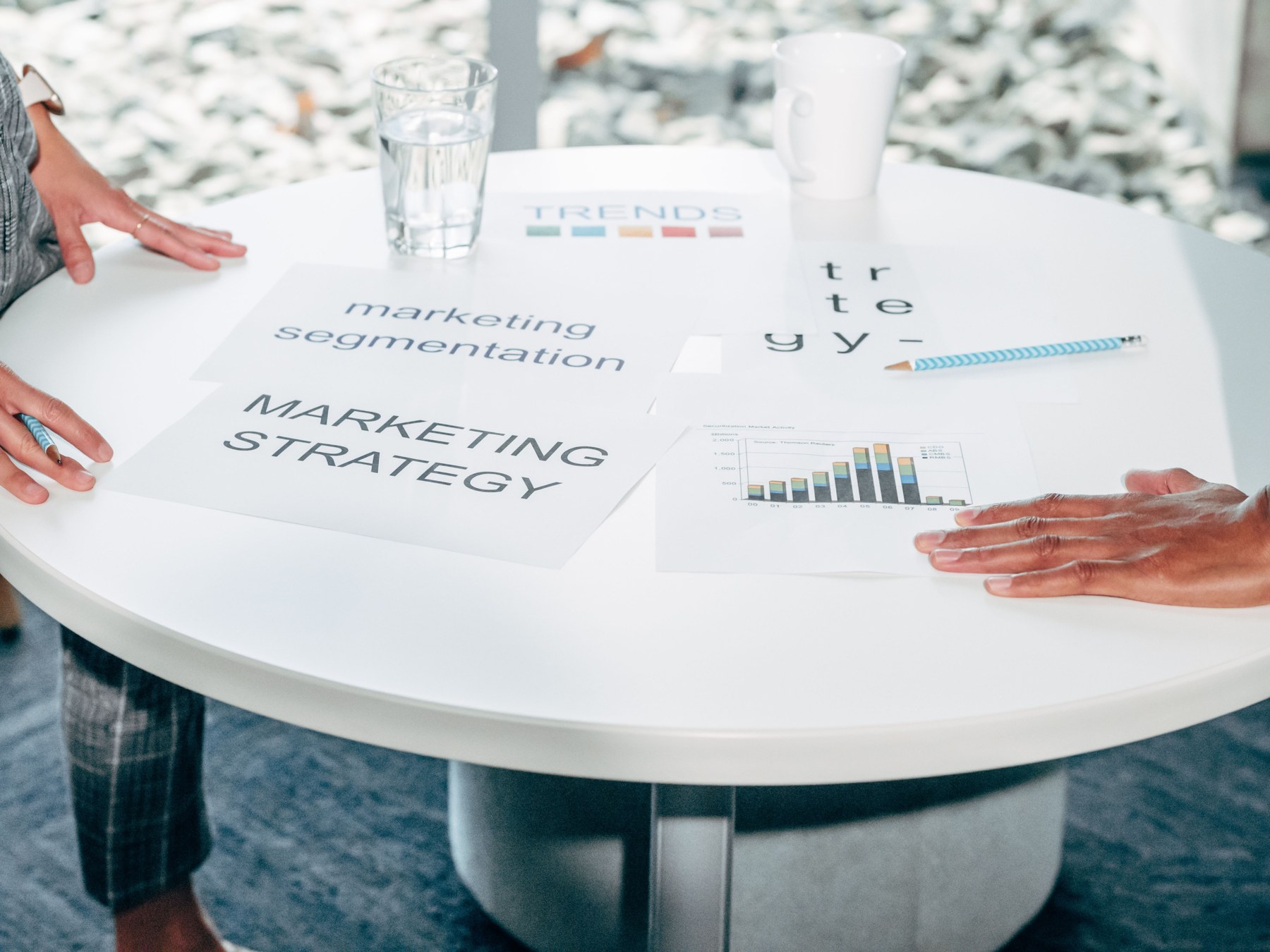 Marketing documents being reviewed at a round table